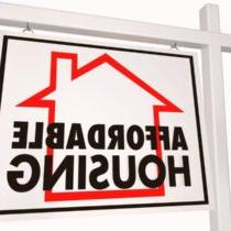 photo of realtor type sign with words affordable housing